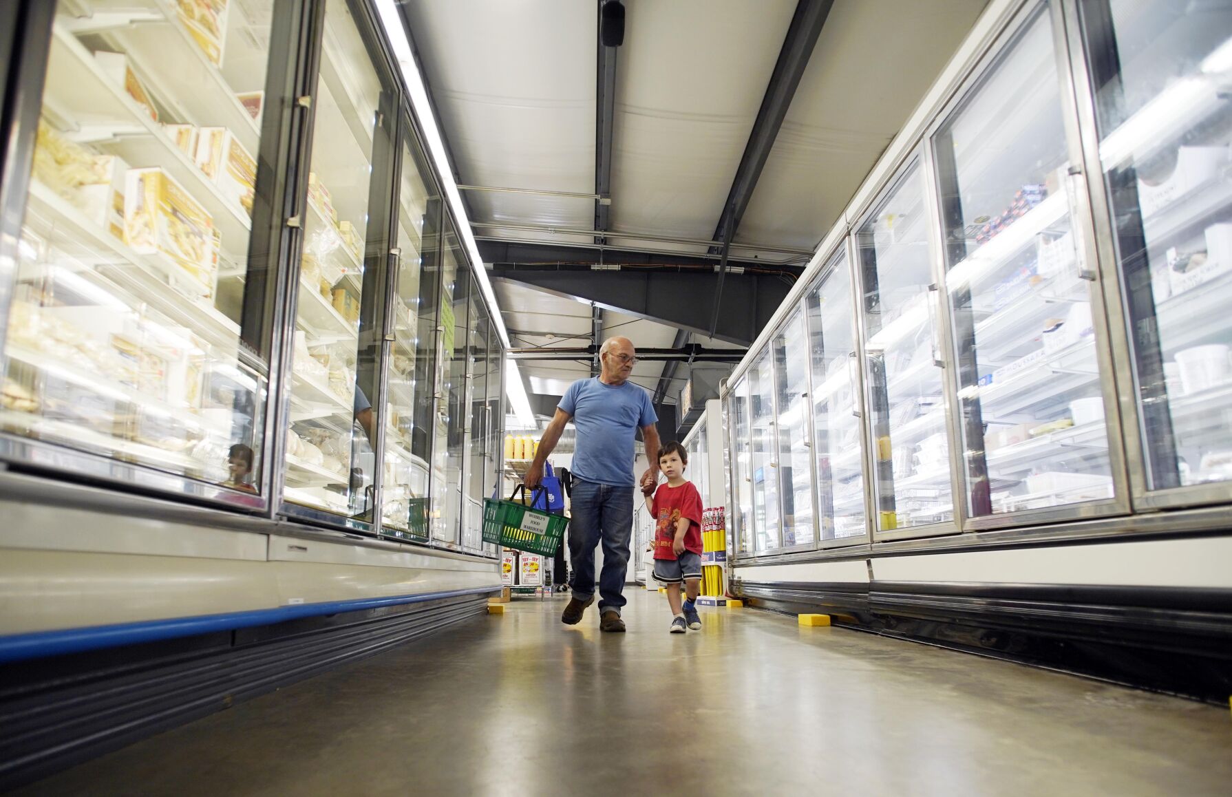 Man and child explore Worle’s Foods freezer aisle